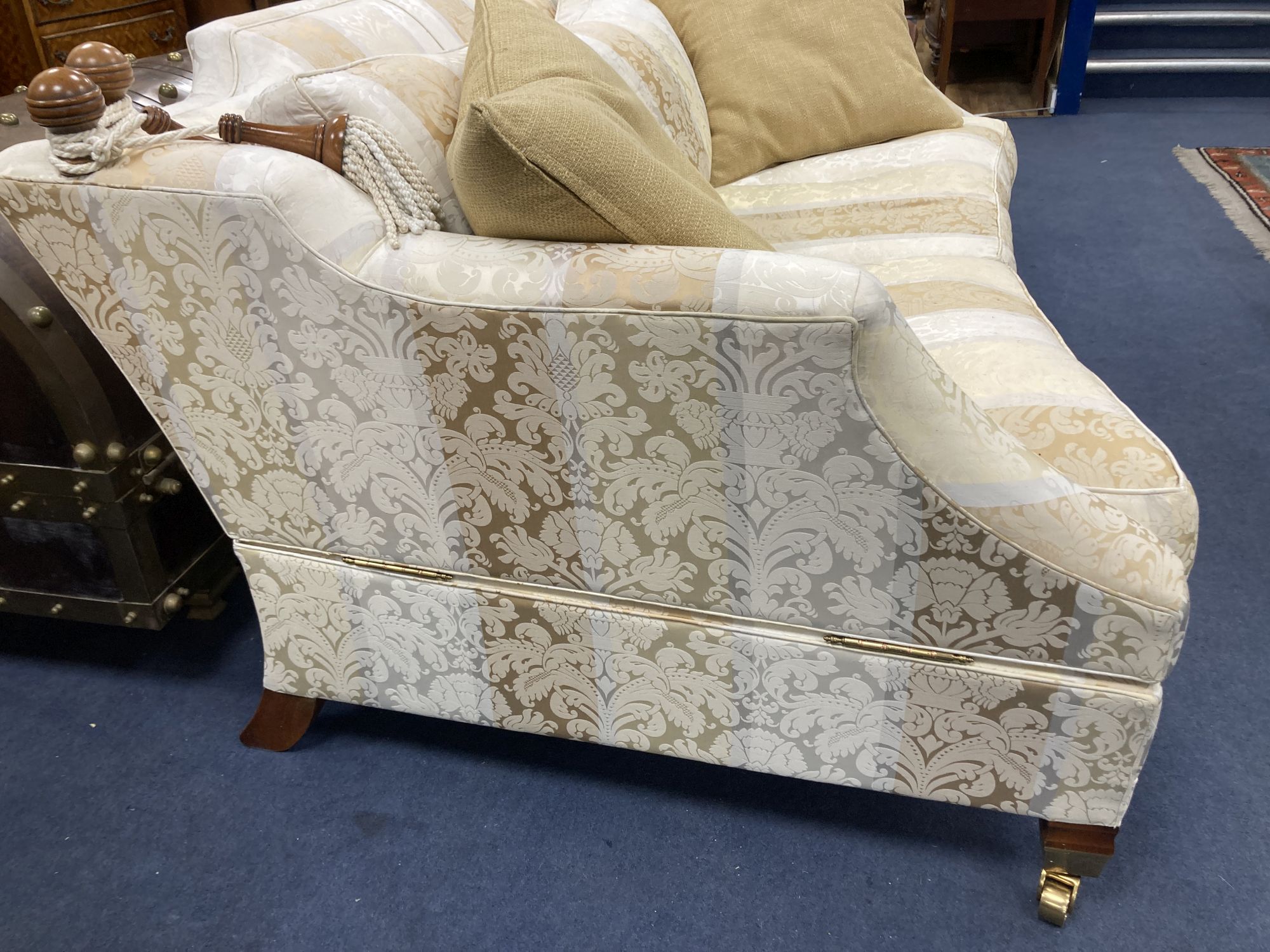 Harrods. Two large two seater settees, upholstered in cream brocade, larger 238cm, depth 118cm, height 85cm